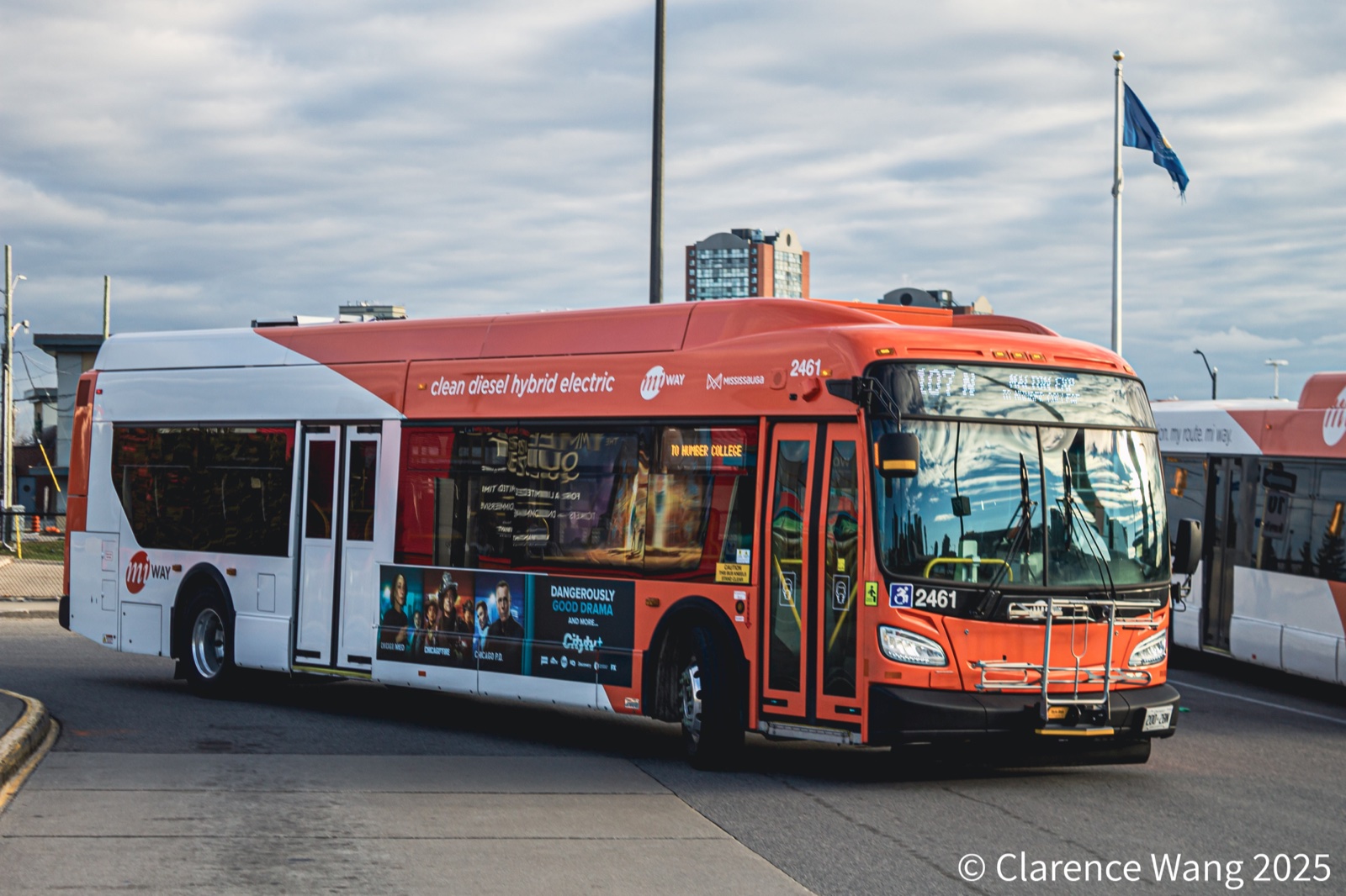 Orange and white MiWay hybrid-electric bus marked 2461.